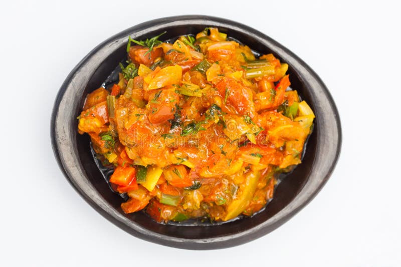 Traditional Colombian sauce called hogao served in a black ceramic dish royalty free stock image Traditional Colombian sauce called hogao served in a black ceramic dish royalty free stock image
