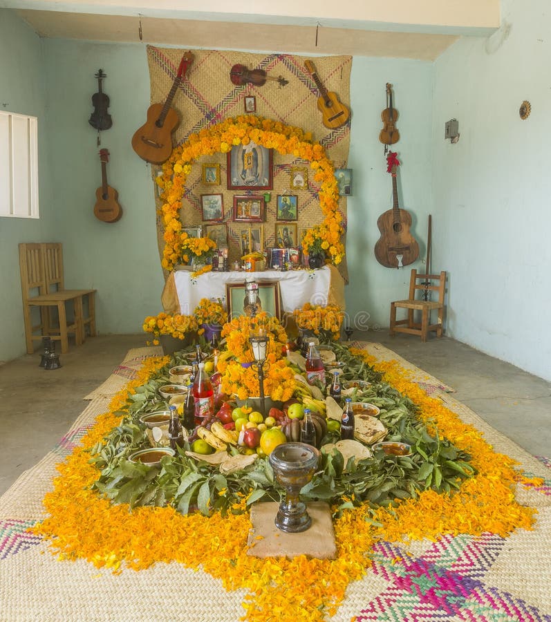 Traditional day of the dead, altar with dead bread, flowers, food and candles. Party celebrated throughout Mexico on October 31