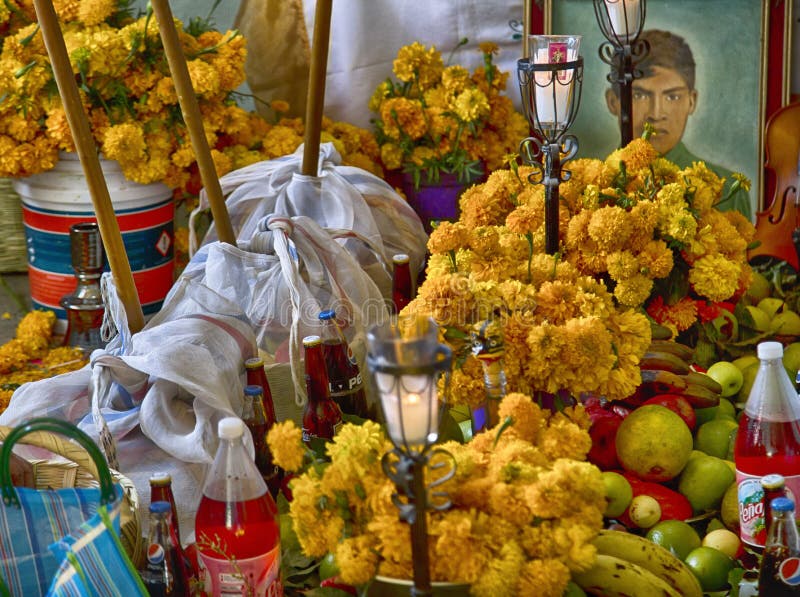 Traditional day of the dead, altar with dead bread, flowers, food and candles. Party celebrated throughout Mexico on October 31