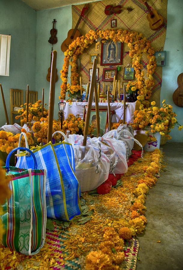 Traditional day of the dead, altar with dead bread, flowers, food and candles. Party celebrated throughout Mexico on October 31
