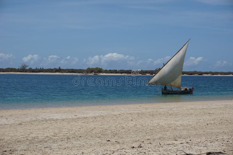 Traditional dhow navigating between Lamu Island and Manda Island royalty free stock photos