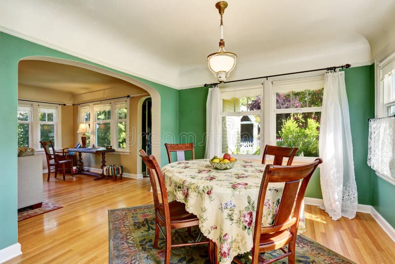 Traditional Dining Area with Wooden Table Set. Open Floor Plan Stock