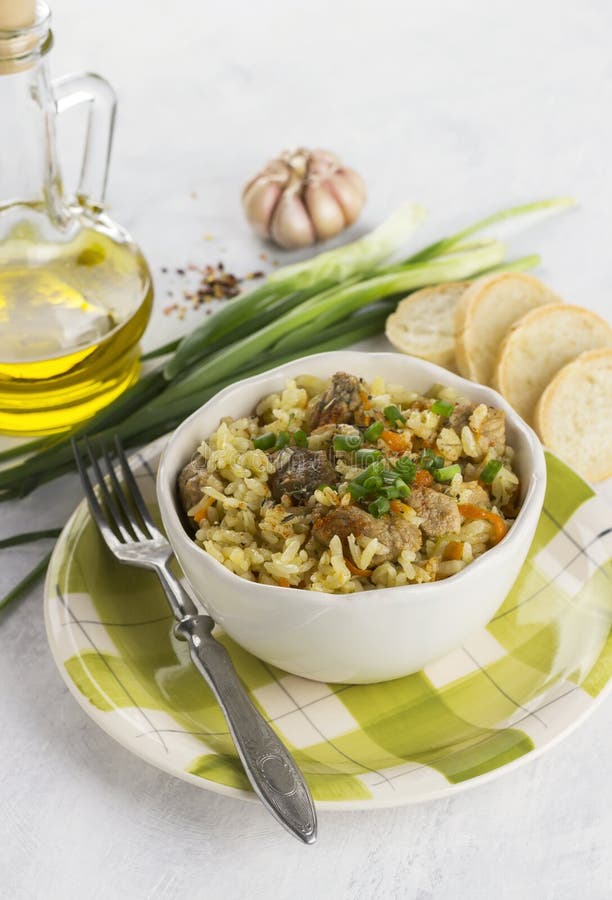 Traditional Dish Pilaf with Meat, Rice and Vegetables. on White Stock