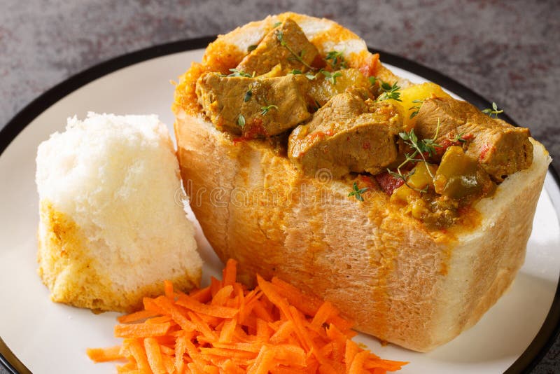 Traditional Durban Mutton Bunny Chow Closeup on Plate. Horizontal Stock