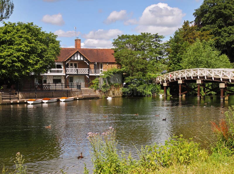 Traditional English Riverside House and Footbridge