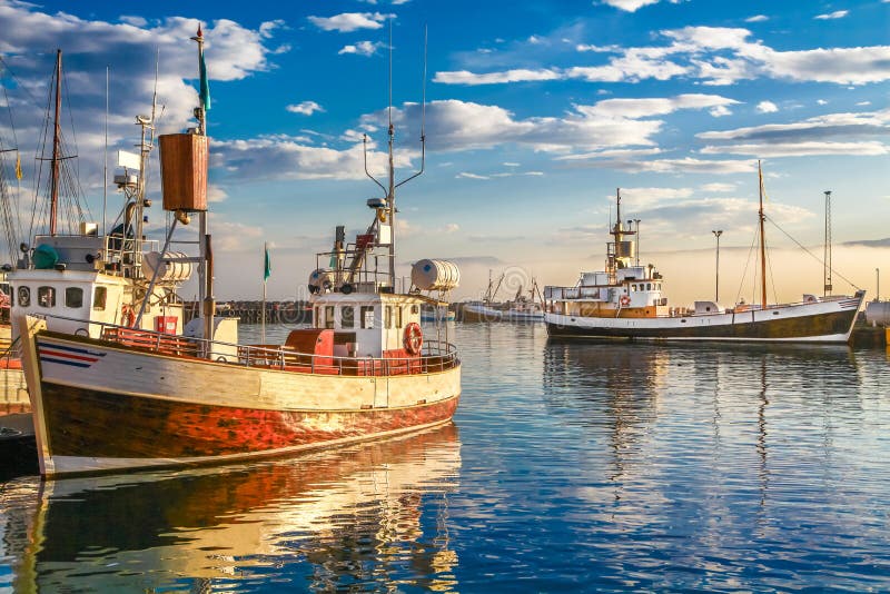 Traditional fisherman boats in Iceland at sunset stock images Traditional fisherman boats in Iceland at sunset stock images