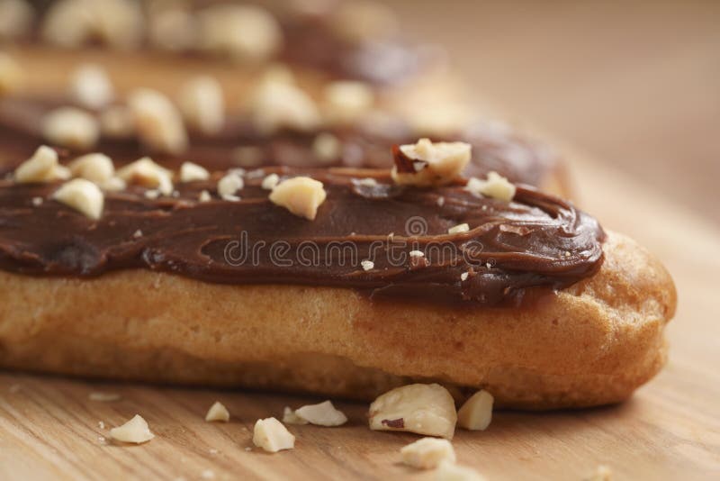 Traditional French Eclairs with Chocolate and Hazelnuts Stock Image