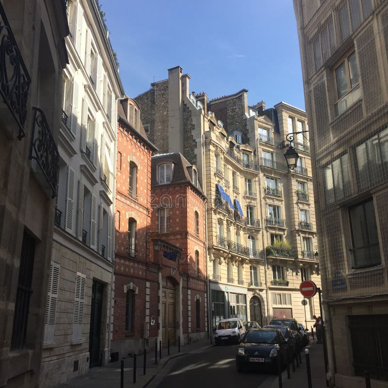 Traditional French Style Street in Paris with Sunshine Editorial Image