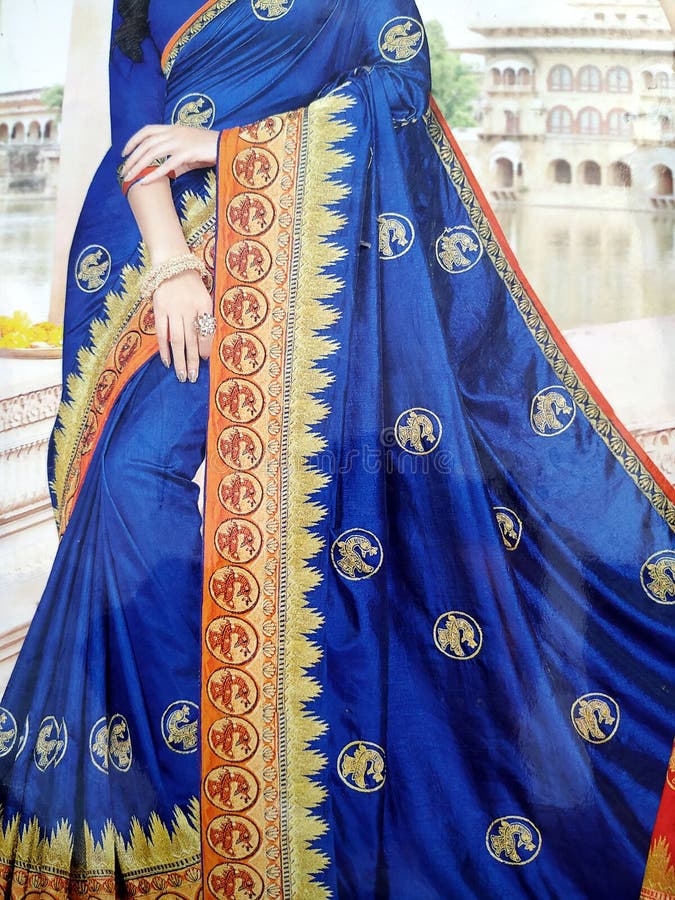 Traditional handmade white, red/pink, blue Indian silk sari /saree with golden details, woman use to wear on Onam festival, Vishu, stock images Traditional handmade white, red/pink, blue Indian silk sari /saree with golden details, woman use to wear on Onam festival, Vishu, stock images