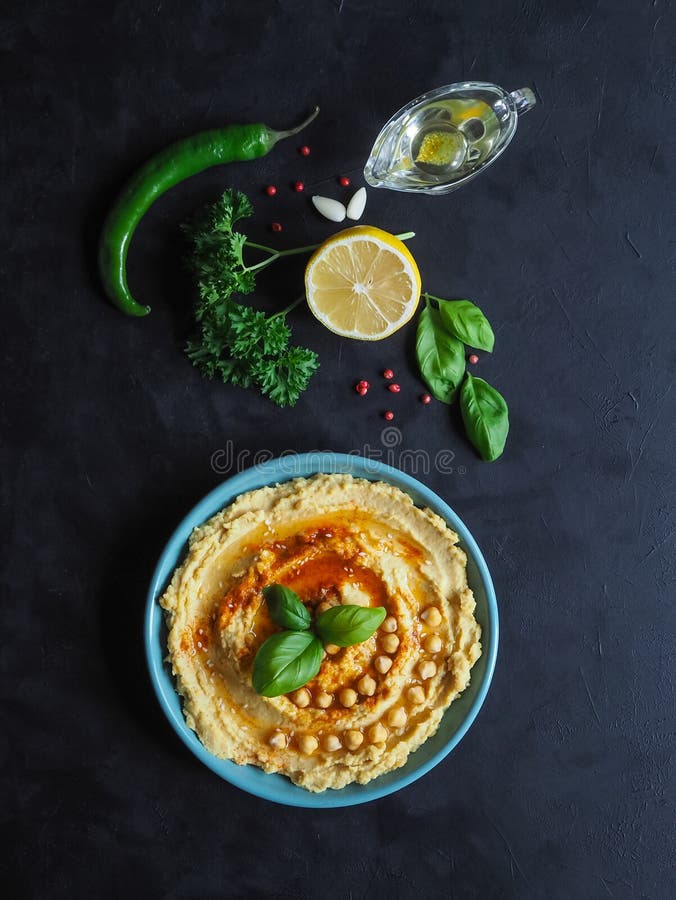 Traditional Hummus on a Black Kitchen Table. Stock Image - Image of ...