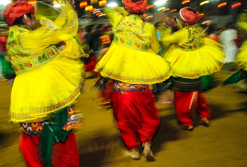 Traditional indian dancers at navratri festival in india at night stock photo Traditional indian dancers at navratri festival in india at night stock photo