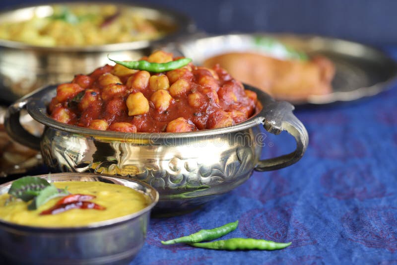 Traditional Indian home-cooked dinner. dishes of national Indian cuisine on a dark blue background. rice, dal, sabji, pakora. top stock photos Traditional Indian home-cooked dinner. dishes of national Indian cuisine on a dark blue background. rice, dal, sabji, pakora. top stock photos