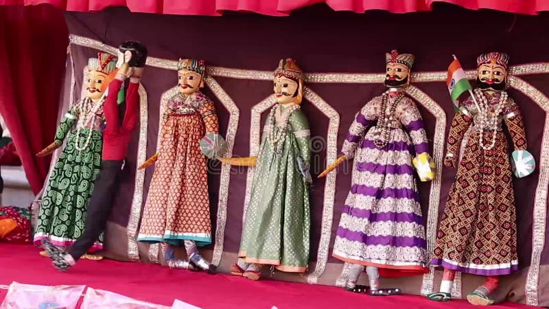 Traditional Indian Puppet Show of Rajasthan showing dancing puppets which are traditional form of fun and entertainment.