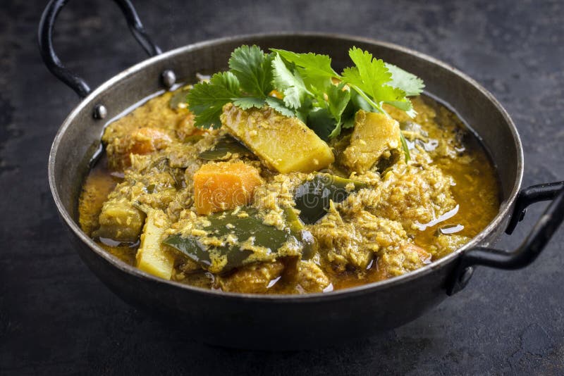 Traditional Indian Sweet Potato Curry with Eggplant in a Design Bowl