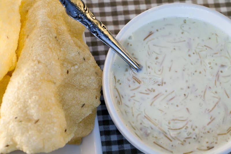 A Traditional Indian Vermicelli Dessert with Poppadams Stock Image