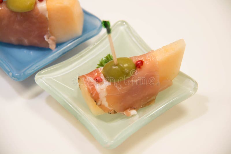 Italian appetizer sliced Parma ham with melons