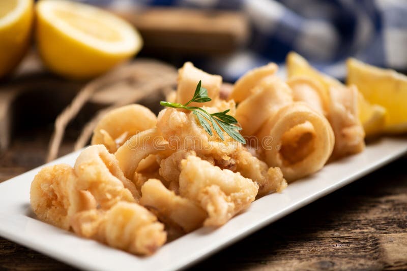 Traditional Italian fried calamari and lemon slice