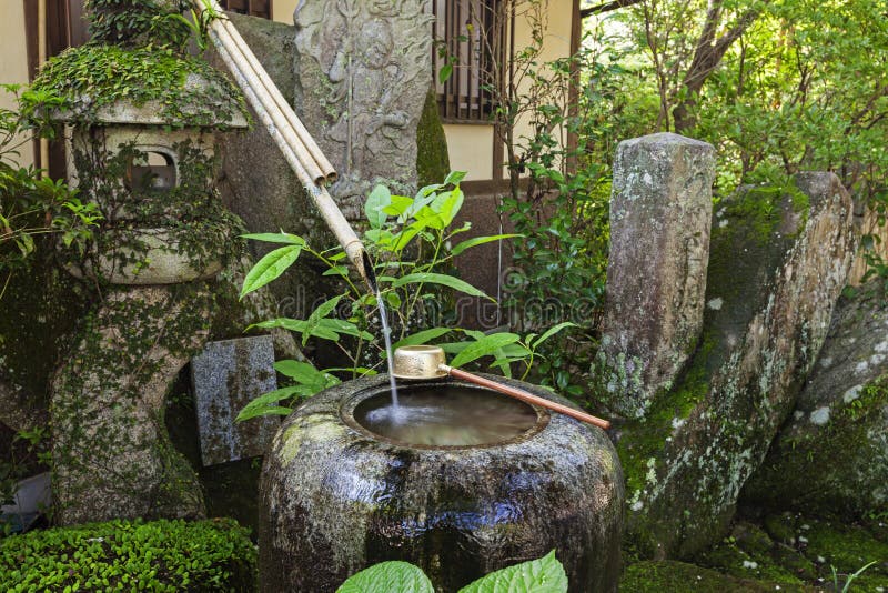 Traditional japanese bamboo purification fountain for purification at entrance of the Japanese temple.