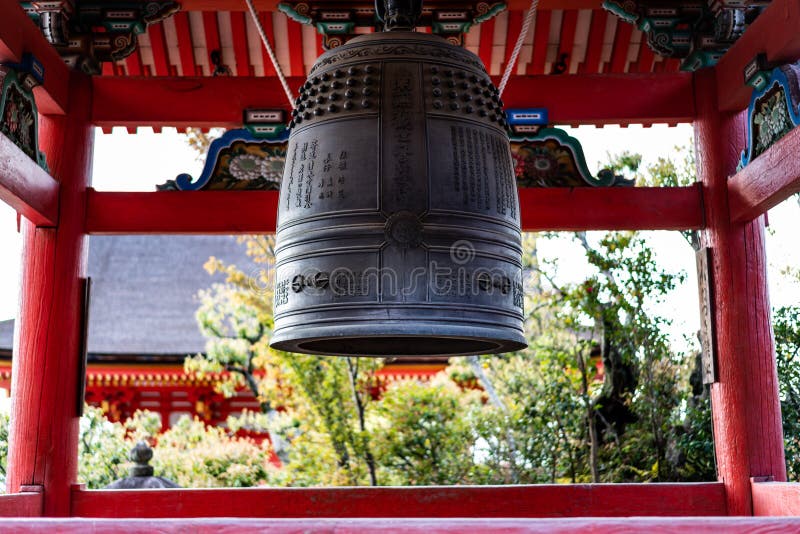 Traditional Japanese bell in a temple inscribed with Japanese wishes for prayers stock images Traditional Japanese bell in a temple inscribed with Japanese wishes for prayers stock images