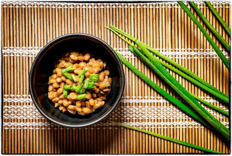 Traditional Japanese Fermented Beans Seasoned with Raw Green Onions for Breakfast .