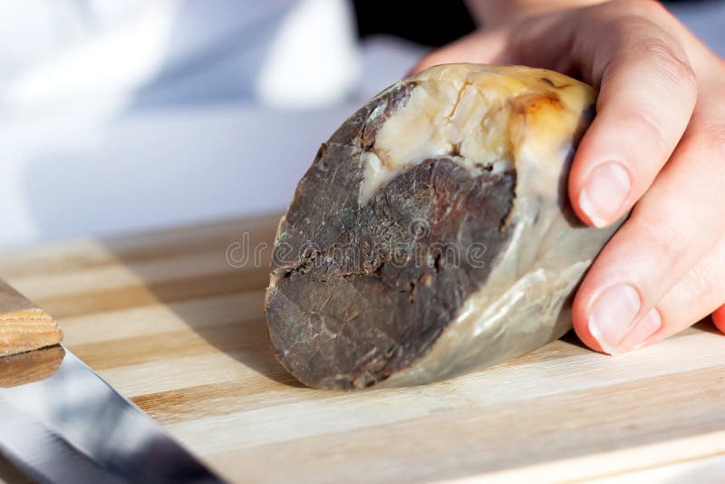 The traditional Kazakh horse meat sausage Kazy on the wooden cutting board close up. stock image The traditional Kazakh horse meat sausage Kazy on the wooden cutting board close up. stock image