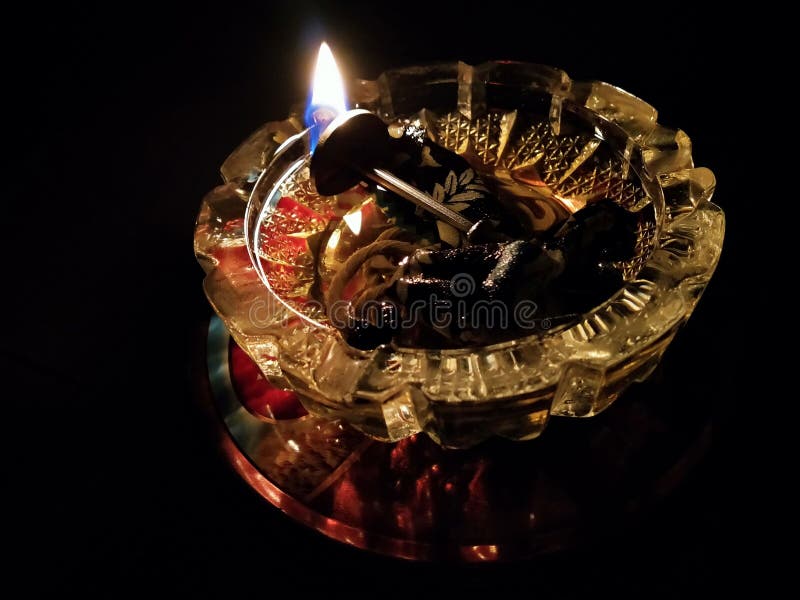 A Traditional Lamp Made from Cooking Oil and Cotton Placed on a Crystal
