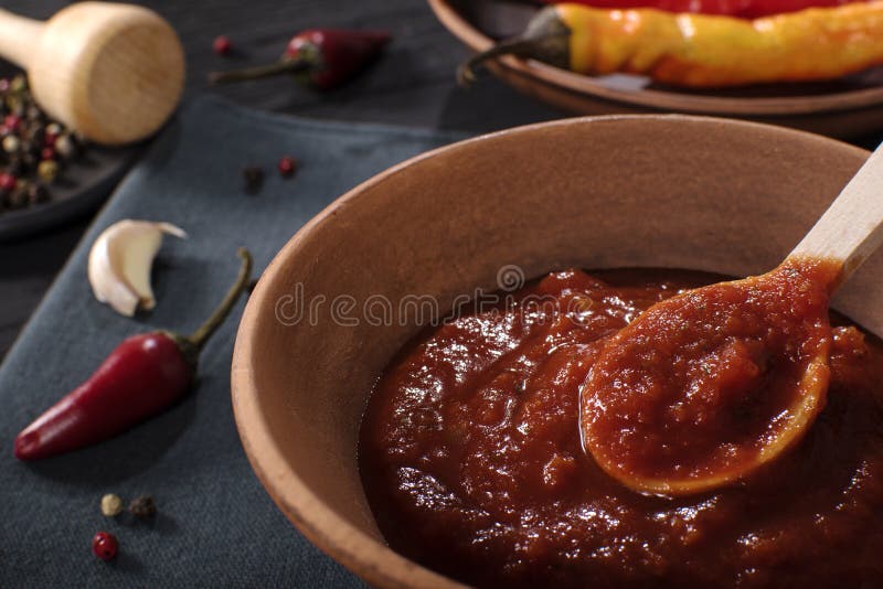 Traditional Maghrebi hot chili pepper sauce paste harissa. Tunisia and Arabic cuisine adjika