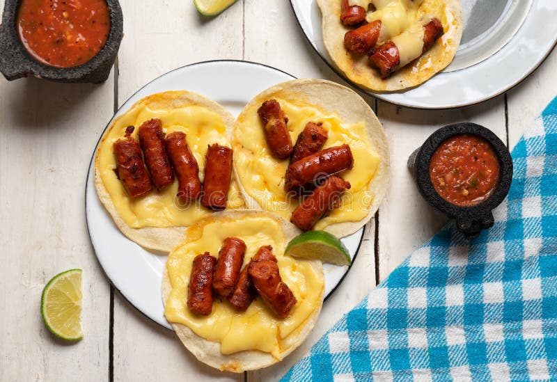 Mexican Chistorra Tacos with Cheese on White Background Stock Image