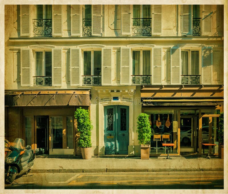 Traditional Parisian house with cafe. Old photo