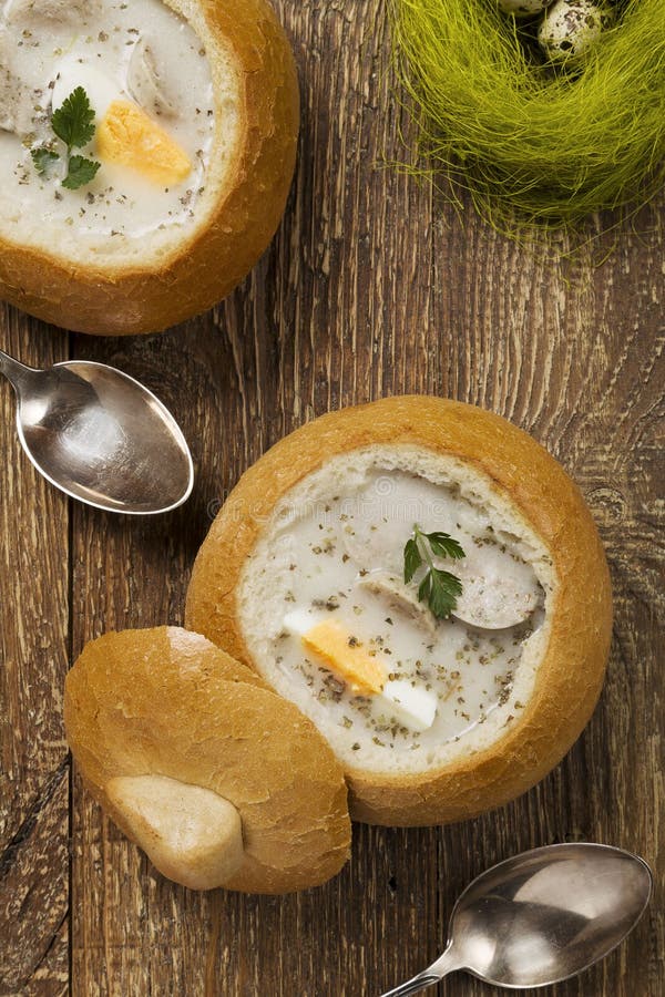 Traditional Polish White Borscht with Eggs and Sausage in Bread Stock