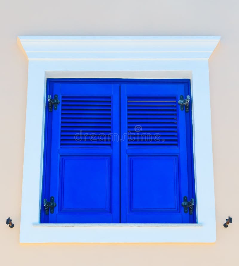 Traditional rectangular wooden closed window on a bright pink wall , architecture details Santorini, Greece royalty free stock images Traditional rectangular wooden closed window on a bright pink wall , architecture details Santorini, Greece royalty free stock images