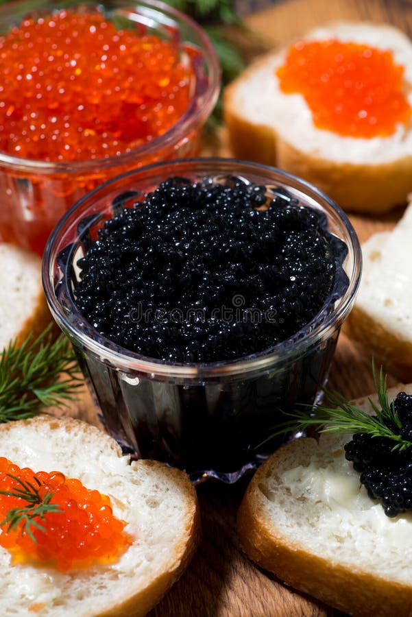 Traditional Red and Black Caviar and Sandwiches on Wooden Board Stock ...