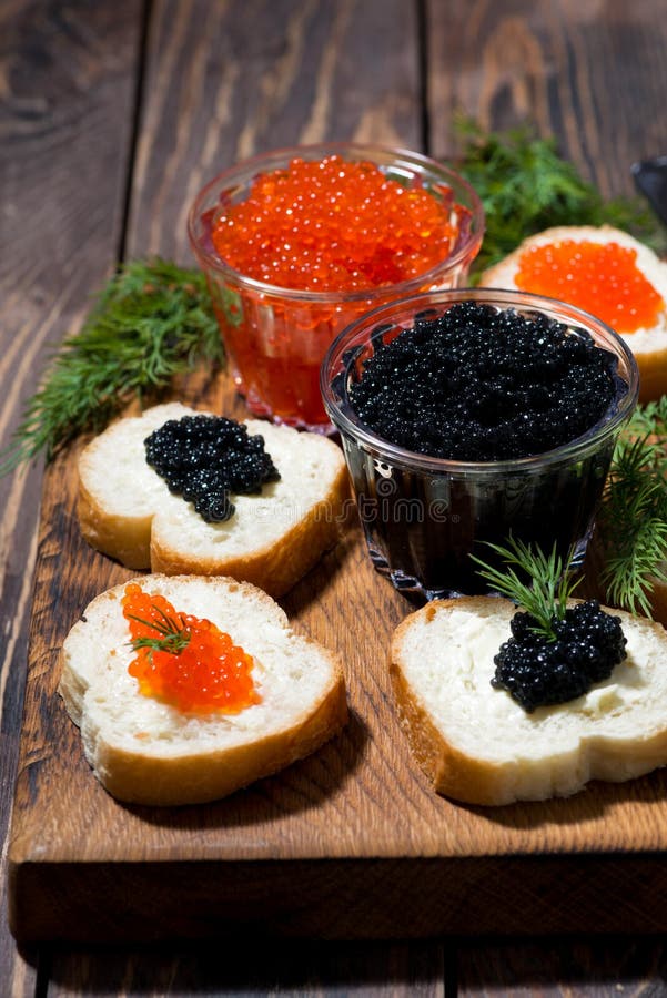 Traditional Red and Black Caviar and Sandwiches on Wooden Board Stock ...