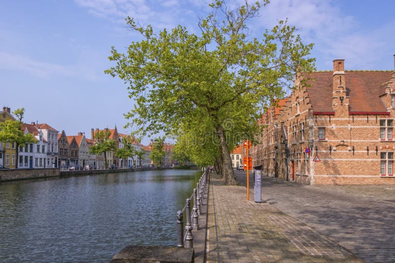 Traditional red brick house and canal in Bruges, Belgium stock photos Traditional red brick house and canal in Bruges, Belgium stock photos