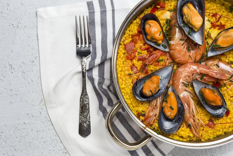 Traditional Rice in Paella with Fish and Meat. Stock Photo Image of