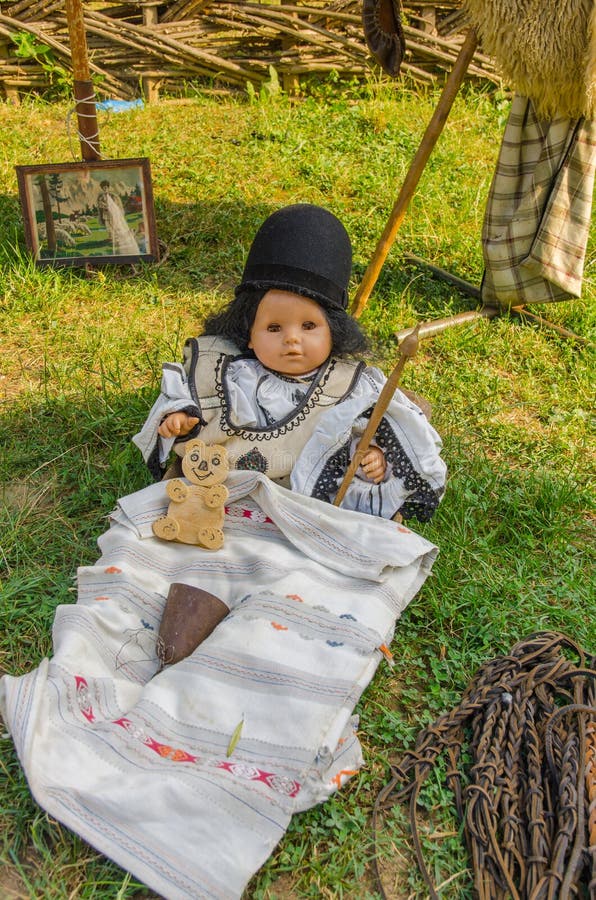 Traditional romanian baby doll in wood crib. Little marionette stock images, royalty-free photos and pictures