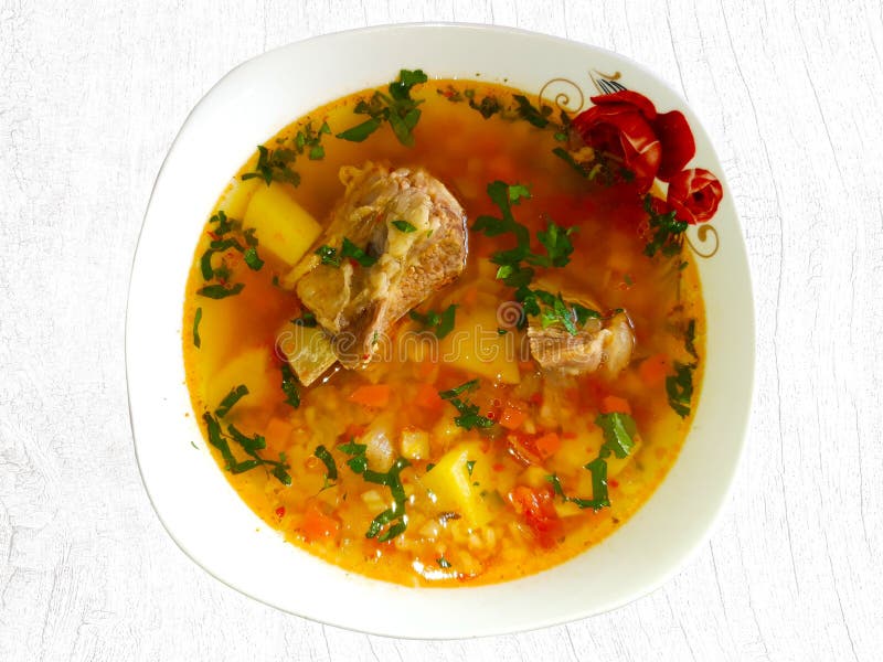 Traditional Romanian beef soup with vegetables