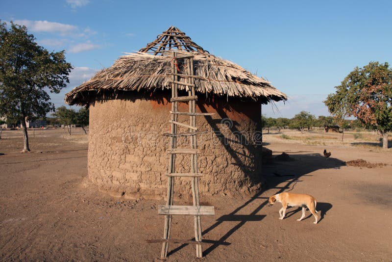  Traditional Round Hut Village Residents In Botswana Stock 