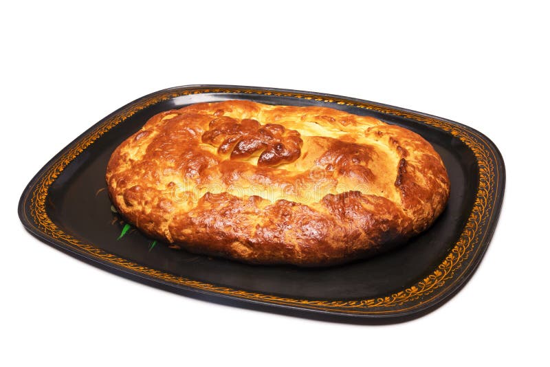 Traditional russian closed pie with cabbage on a tray, isolated on white background stock images Traditional russian closed pie with cabbage on a tray, isolated on white background stock images