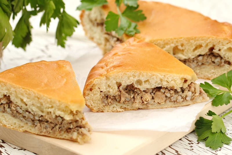 Kurnik, Russian Meat Pie. a Traditional Dish of Dough Lies in a Black Pan  on the Table Stock Photo - Image of cooking, bakery: 140166536