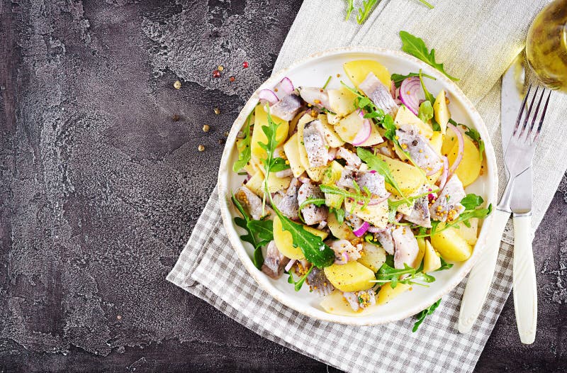 Traditional salad of salted herring fillet, fresh apples, red onion and potatoes.