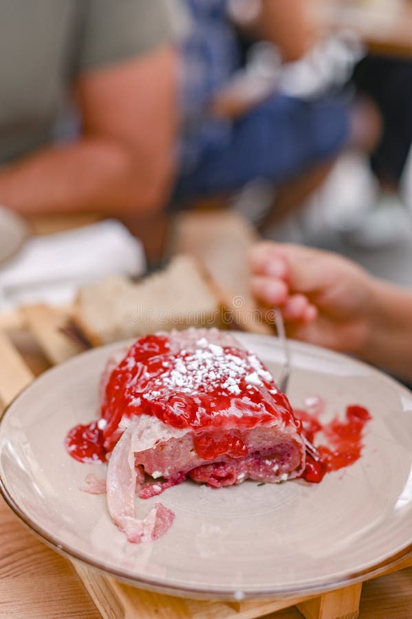 Traditional Slovenian dessert made of dough, cheese and fruit. Dumplings with raspberries for a delicious breakfast in a European stock photo Traditional Slovenian dessert made of dough, cheese and fruit. Dumplings with raspberries for a delicious breakfast in a European stock photo