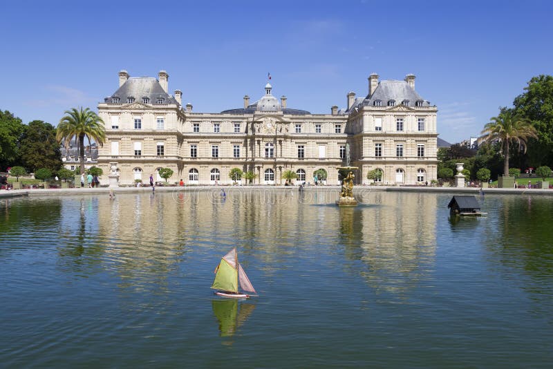 Traditional small wooden sailing boat in the pond of park Jardin du Luxembourg, Paris, France
