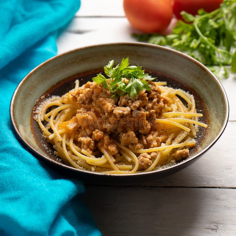 Spaghetti Bolognese with Parmesan Cheese on White Background Stock