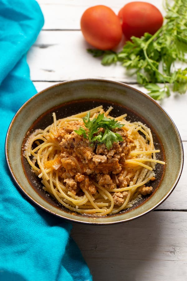 Spaghetti Bolognese with Parmesan Cheese on Dark Background Stock Photo