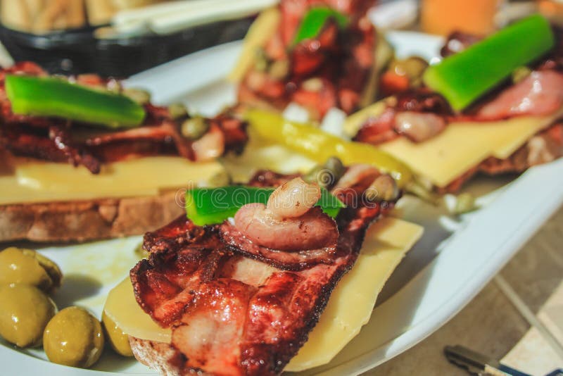 Traditional Spanish Tapas with Bacon and Cheese on Bread Stock Image