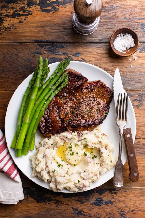 Traditional Steak and Mashed Potatoes with Asparagus Stock Image