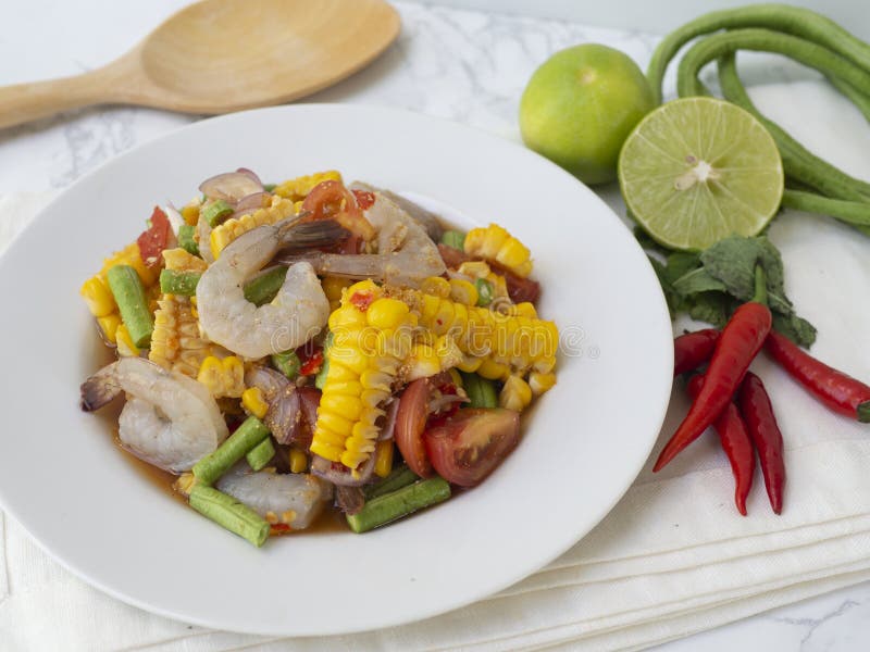 Traditional thai spicy raw shrimp with sweet corn salad