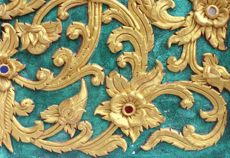 Traditional Thai style art gold painting pattern on the wall