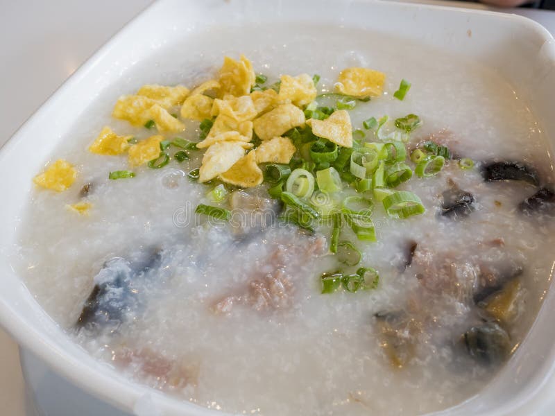 Traditional thousand years egg with pork meat congee stock photo Traditional thousand years egg with pork meat congee stock photo